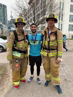 Photo of Ben Bloom with 2 firefighters at run for Camp Ooch