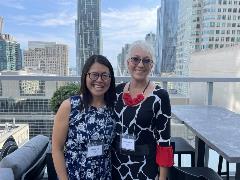 Image: Melodie Eng and Christina Kobi smiling outside on a patio